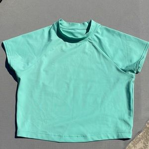 Jolyn x Eryn Krouse size small “Talia” short sleeve crop rash guard